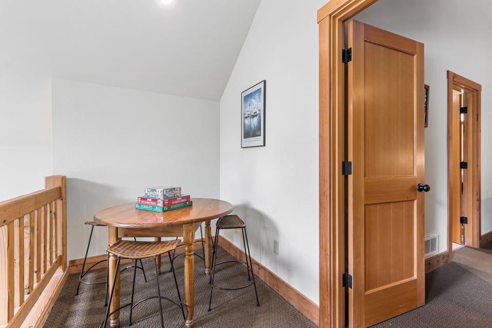 Door to the main bedroom, ensuite bath visible