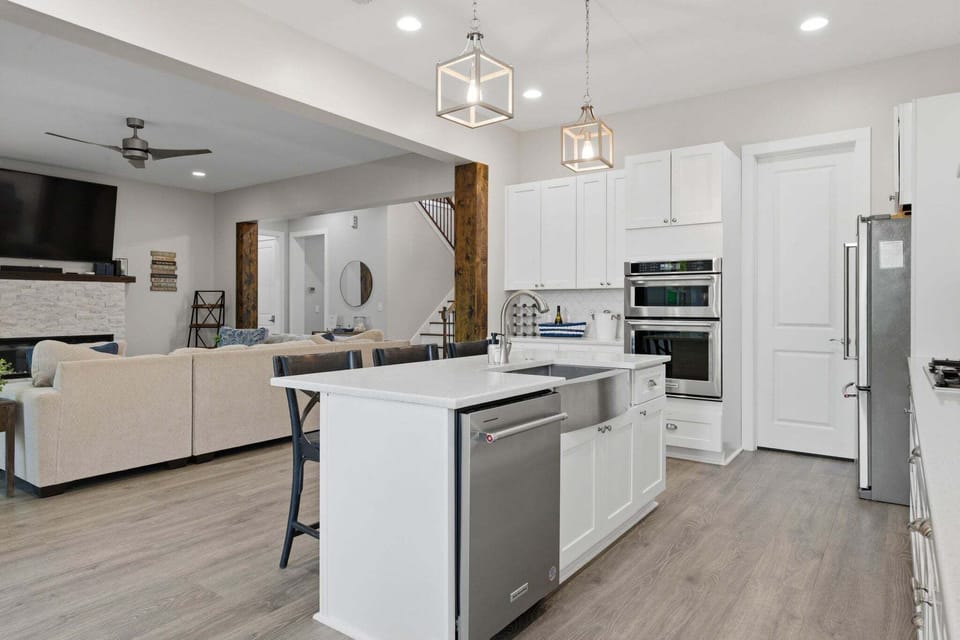 Large, modern fully stocked kitchen with island seating for 3.