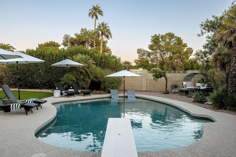 Take a dive or lounge in one of several comfy spots in this gorgeous backyard