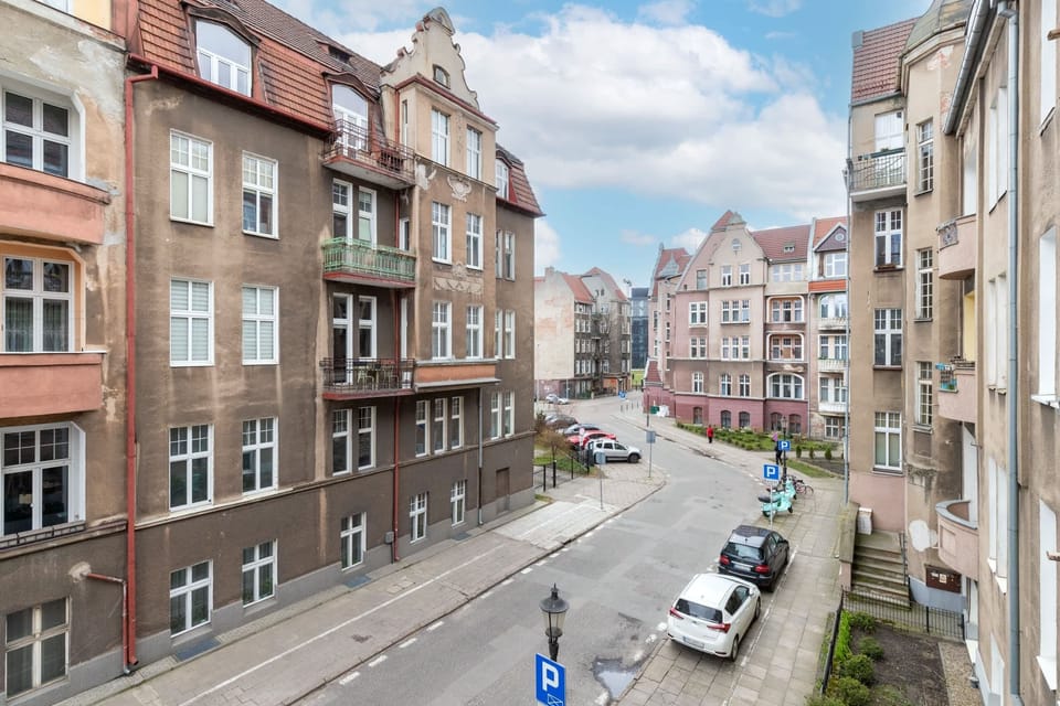 A vibrant city street with historical buildings, showcasing the urban setting and charm of the neighborhood.