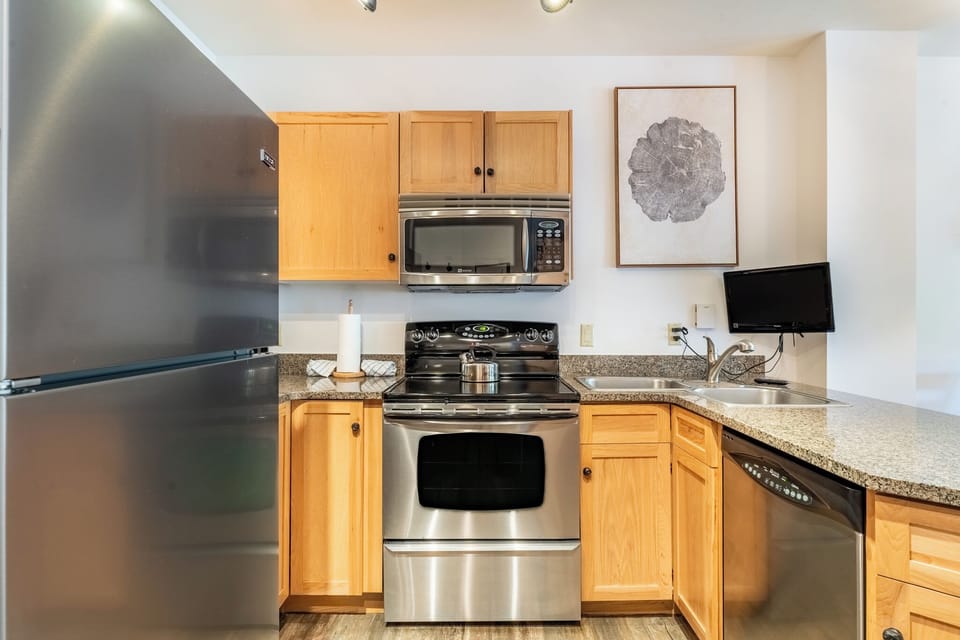 Your fully equipped kitchen features stainless steel appliances and granite countertops, perfect for preparing meals during your stay.