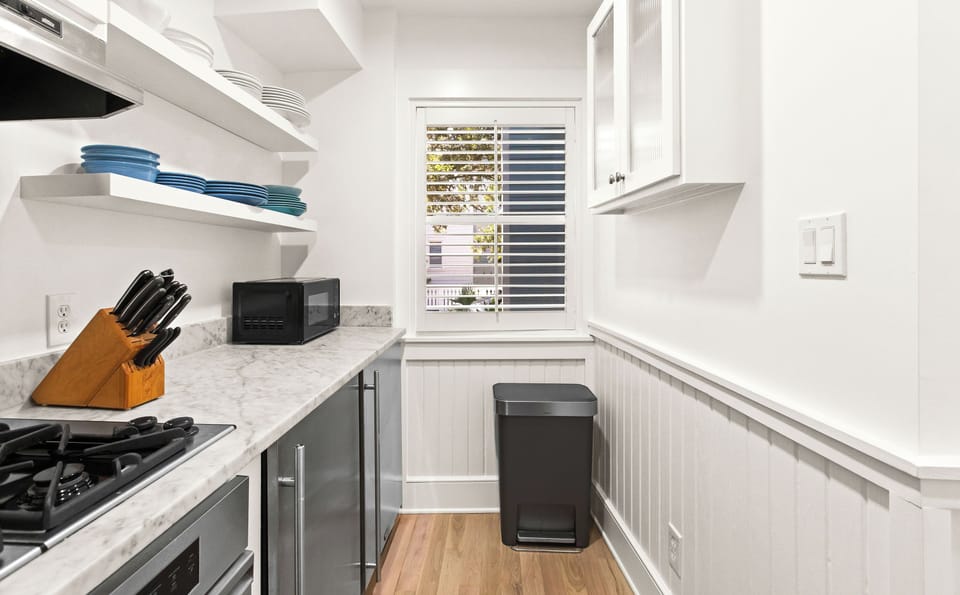 Full kitchen includes side by side compact refrigerators