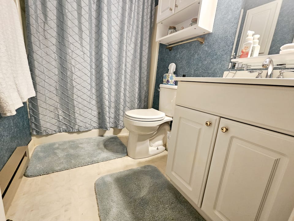 Super clean bathroom with deep tub.