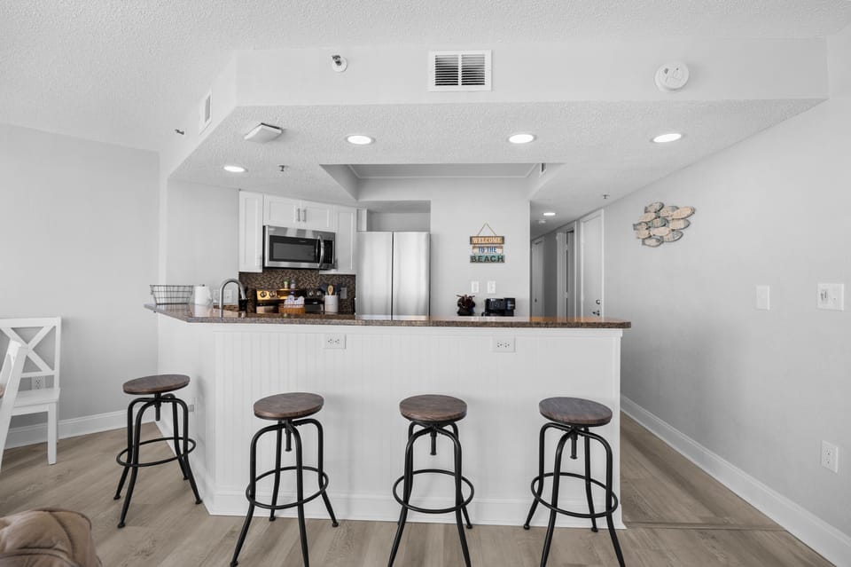 Extra seating at the counter—perfect for morning coffee, quick bites, or keeping the cook company.