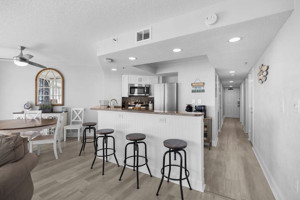Extra seating at the counter—perfect for morning coffee, quick bites, or keeping the cook company.
