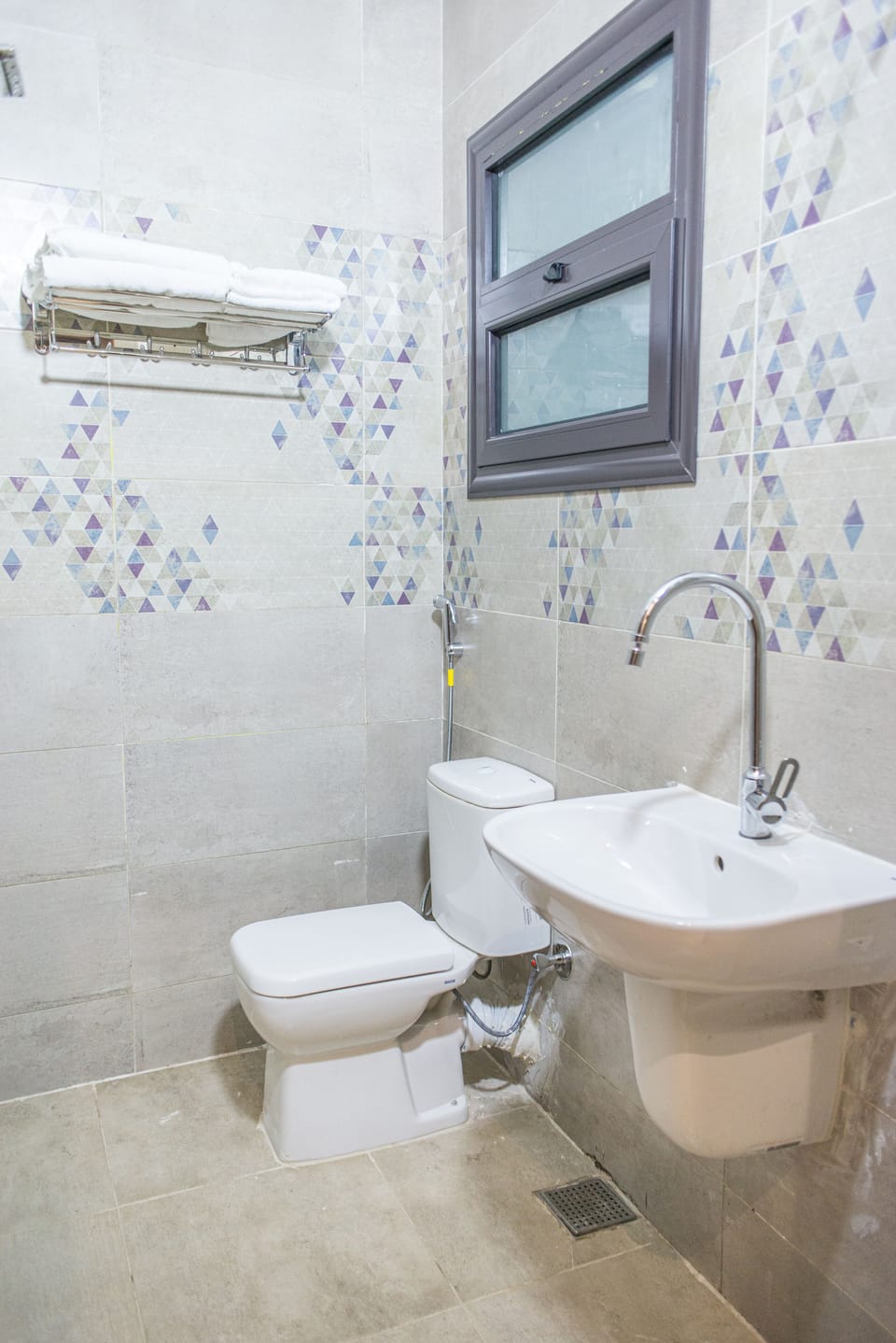 Shower, rainfall showerhead, bidet, towels