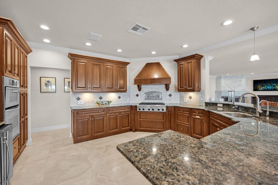 Chefs kitchen with high end stainless steel and gas stove