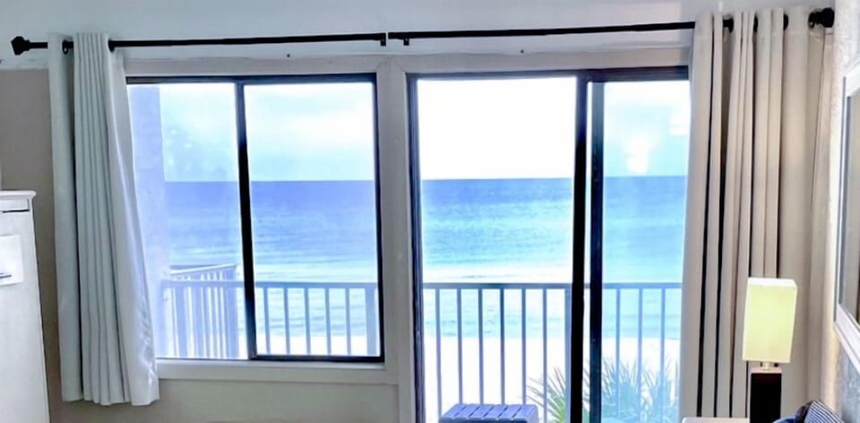 Living room beachfront view and Balcony view.