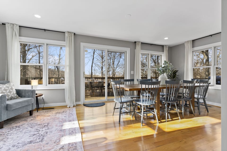 Oversized dining room / sun room with table for 10 plus a sitting area.