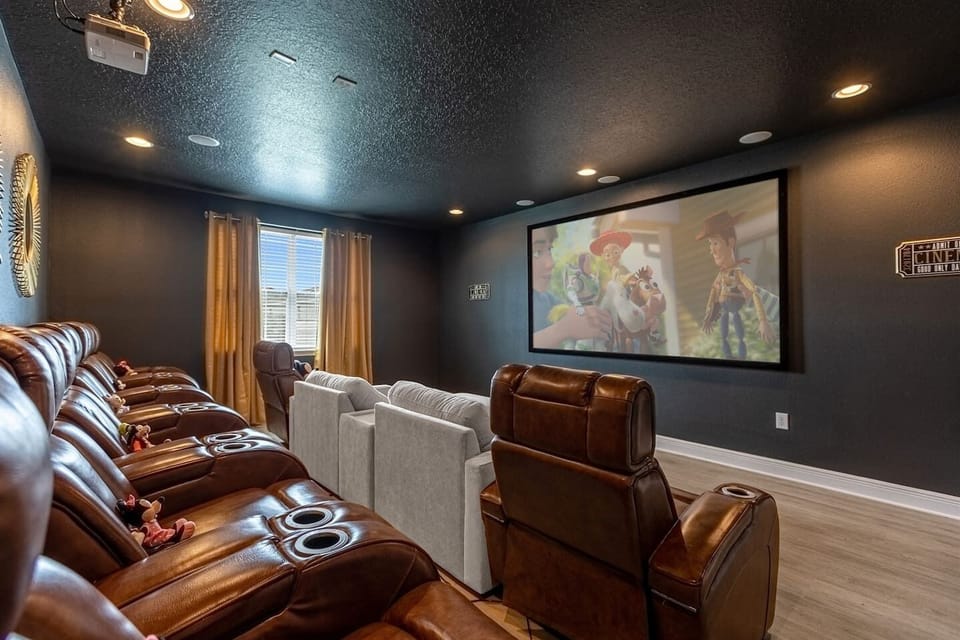 The mini theater is a perfect blend of comfort and style, creating an ideal space for movie nights, game viewings, or simply enjoying a quiet moment with a good film.