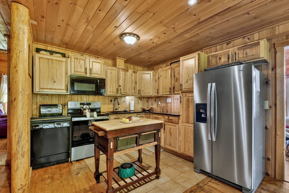 The fully stocked kitchen at Lazy Bear Outlook features granite countertops, updated appliances, and everything you need to cook to your hearts content 