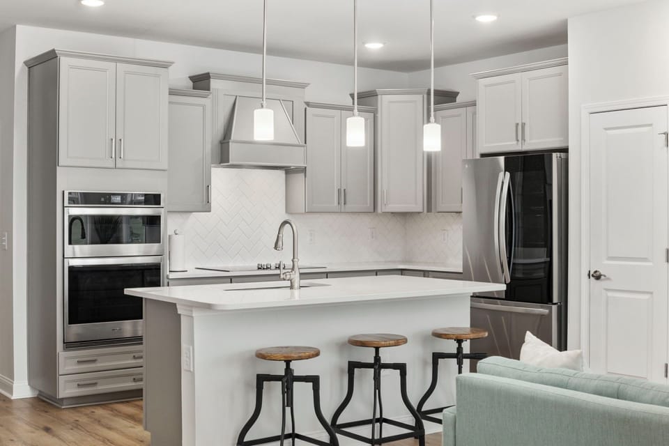 Full kitchen with refrigerator, ice maker, dishwasher, oven, microwave & cooktop