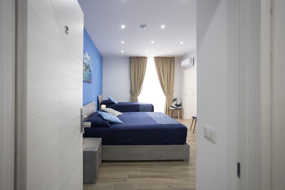 Superior Triple Room | Down comforters, desk, bed sheets