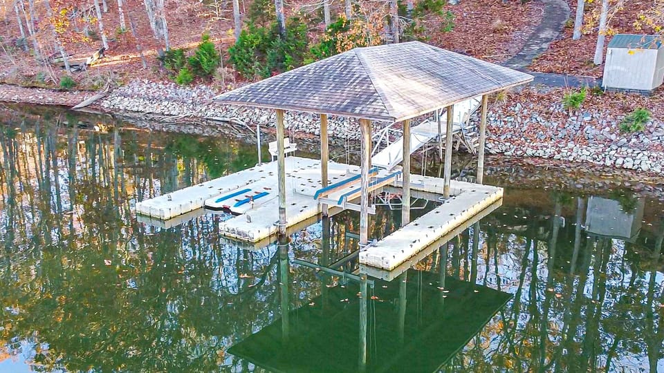 Boat dock with deep water perfect for swimming and accessing the lake.