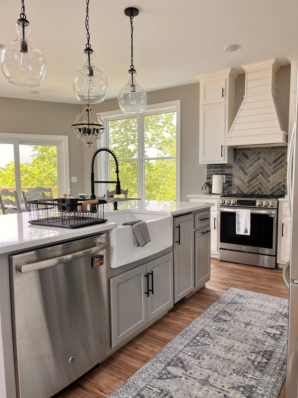 Beautiful farmhouse sink, dishwasher, and under the counter ice maker 