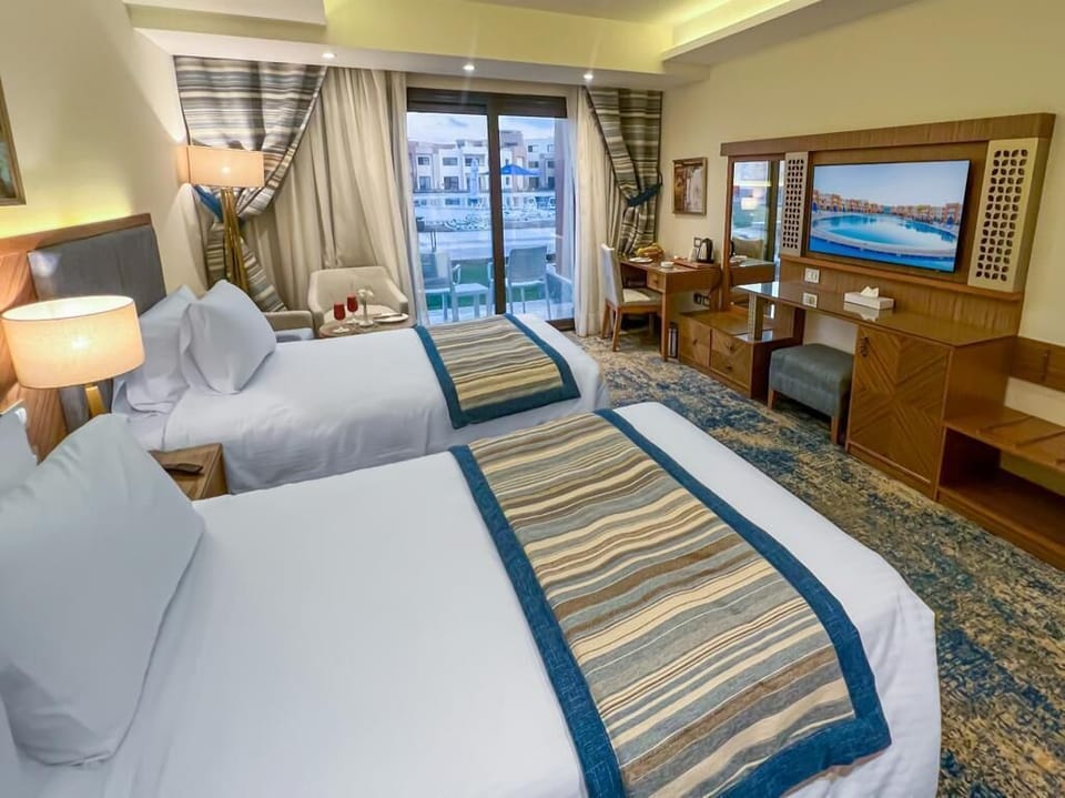 Standard Double or Twin Room | Minibar, in-room safe, desk, laptop workspace