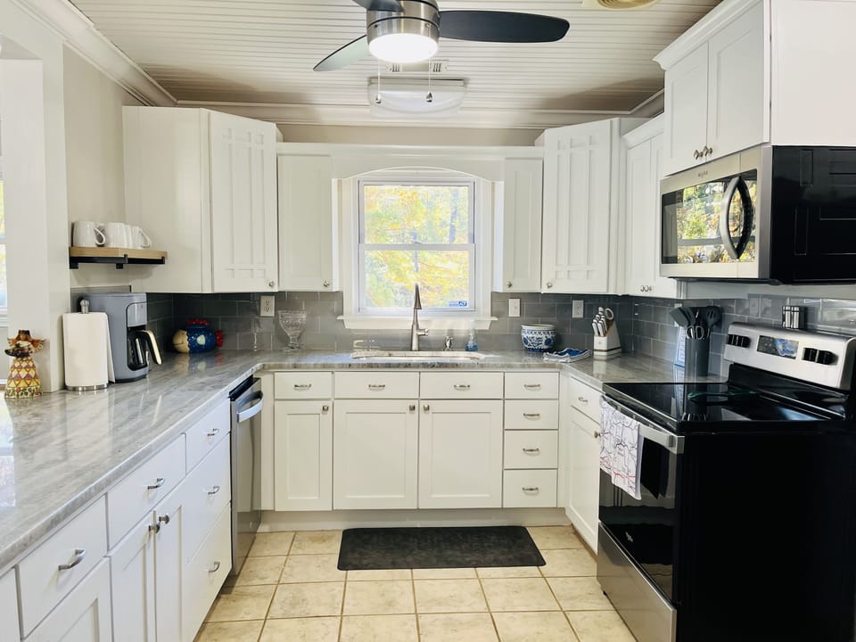 The large kitchen is completely stocked with all the must haves to cook a meal.