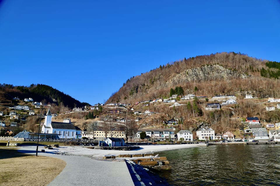A short walk brings you to Øystese Church, beach and bay along Hardangerfjord