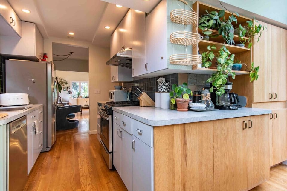 The kitchen features stainless steel appliances and is stoked full of all your kitchen essentials.