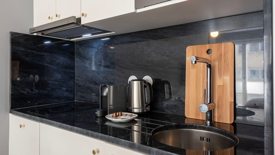 Our kitchenette counts with high quality appliances like a microwave, refrigerator, dishwasher, washing machine, toaster and coffee maker #practical #airbnbporto