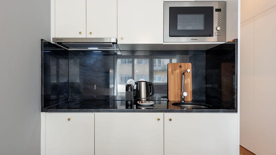 Practical kitchenette equipped with all the appliances required for your basic needs, during your stay #modern #charming