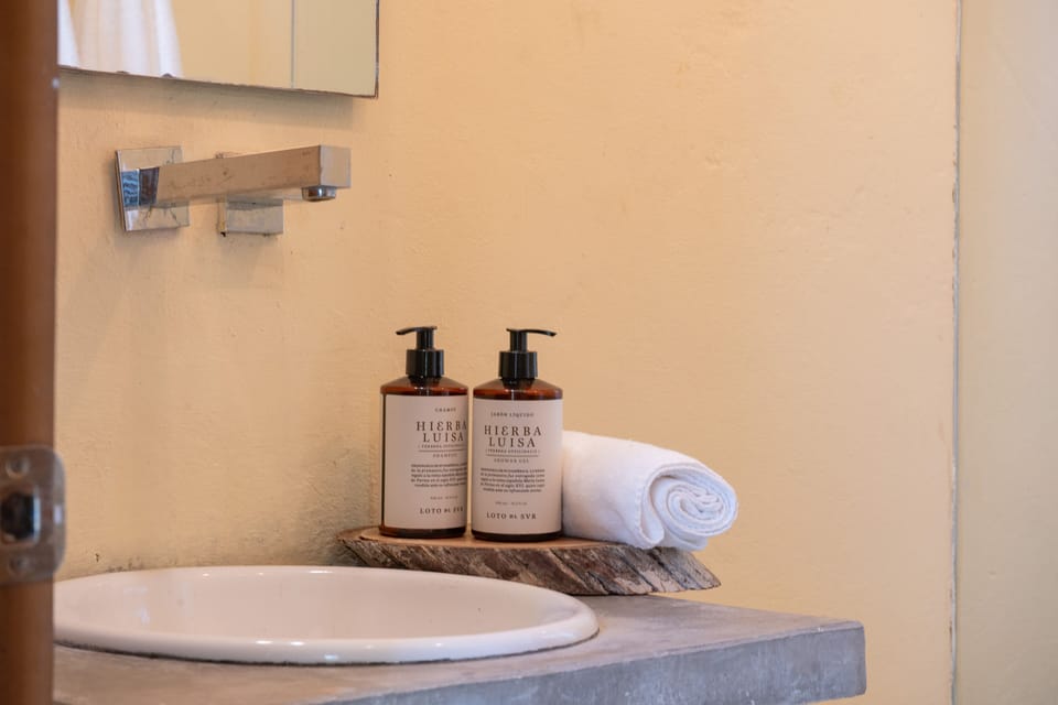 Deluxe Quadruple Room | Bathroom | Shower, rainfall showerhead, designer toiletries, hair dryer