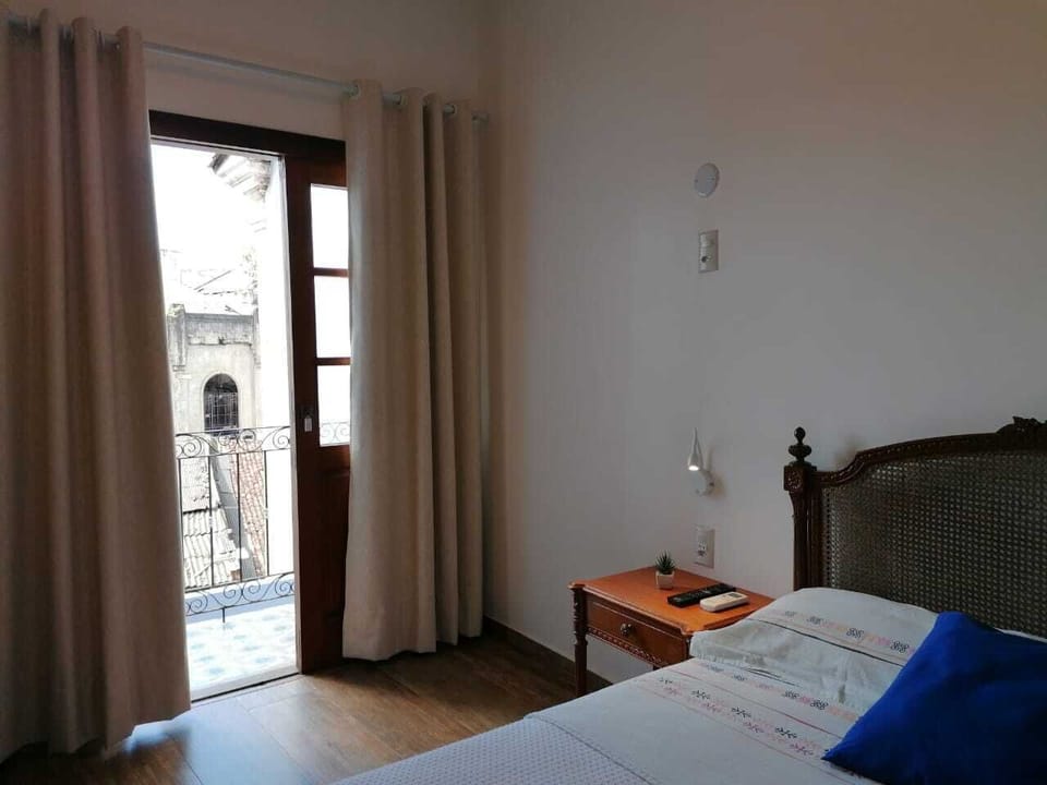 Standard Triple Room | Desk, laptop workspace, blackout drapes, iron/ironing board