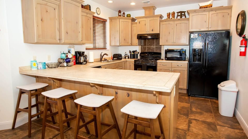 The cozy counter bar has seating for 4 more.