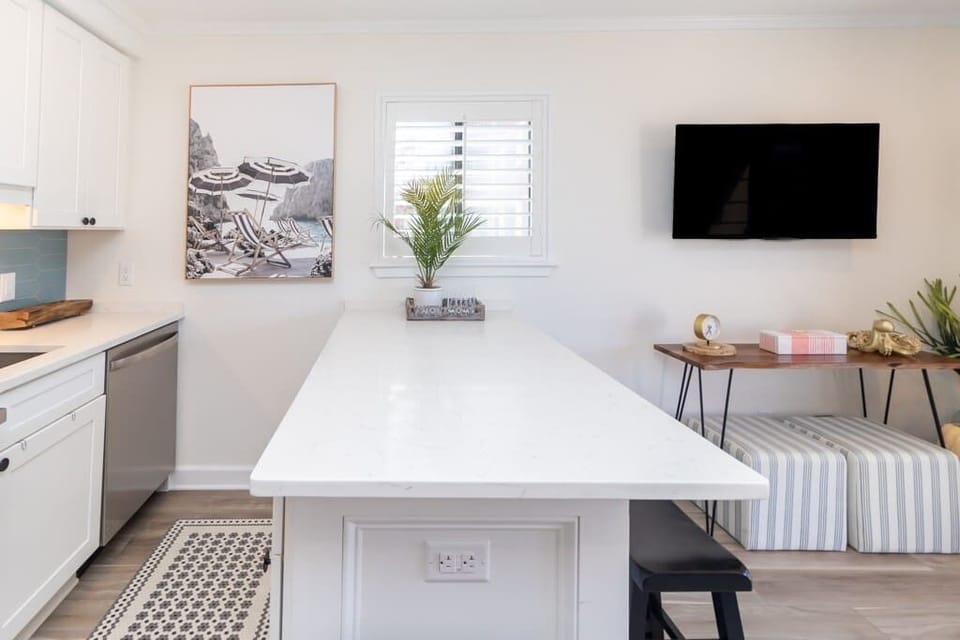 Large island that seats 4 people. Perfect place to meal prep, make drinks or hangout!