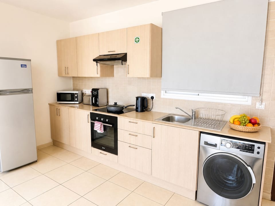 Superior Apartment, 1 Bedroom, Pool View | Private kitchen | Coffee/tea maker, full-size fridge, microwave, oven