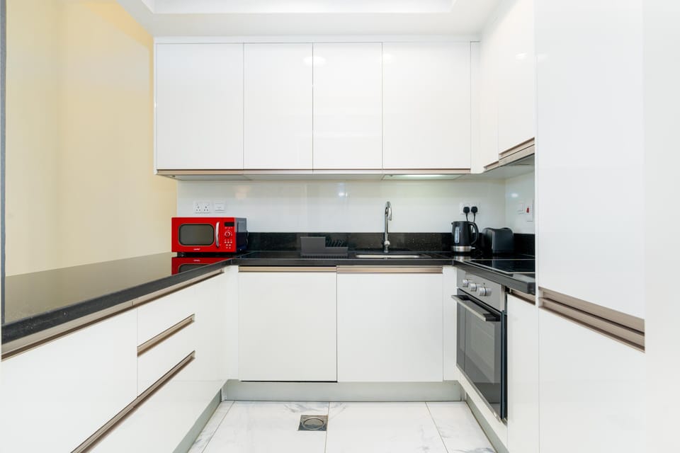 Panoramic Apartment | Private kitchen | Full-size fridge, microwave, oven, stovetop