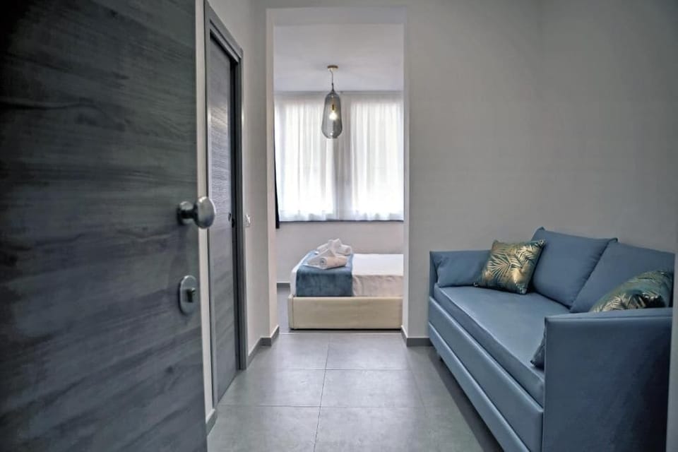 Comfort Triple Room, City View (6) | In-room safe, blackout drapes, soundproofing, iron/ironing board