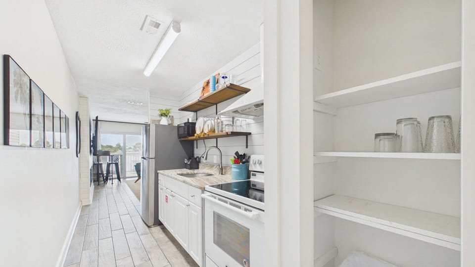 Full kitchen with all the cooking essentials in hallway