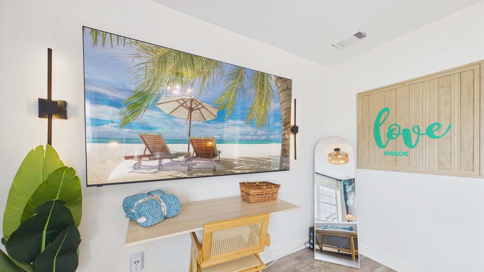 Master bedroom with comfy king bed and huge TV + ensuite bathroom (sleeps 2)