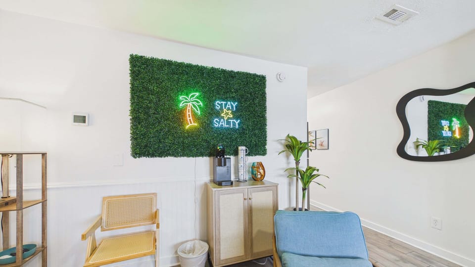 Living area with ample stylish decor and seating + sleeper sofa (sleeps 2)