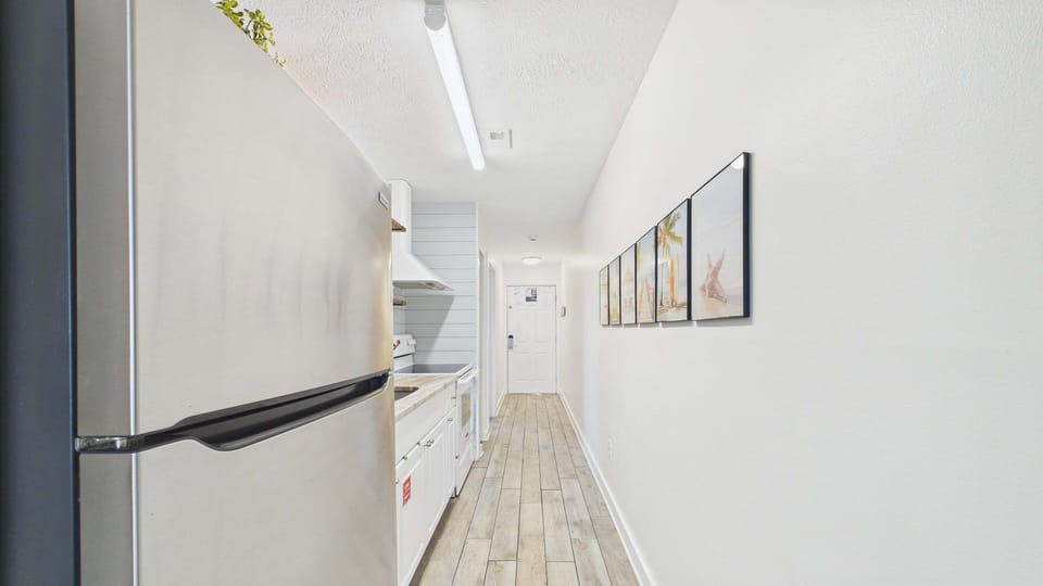 Fully applianced kitchen with coffee essentials and full fridge