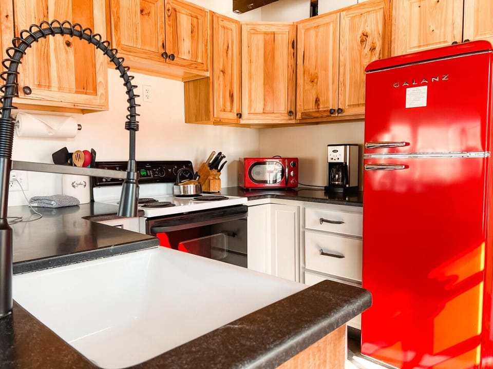 Kitchen is stocked with dishes and all standard cookware. Questions about a specific item? Message us!