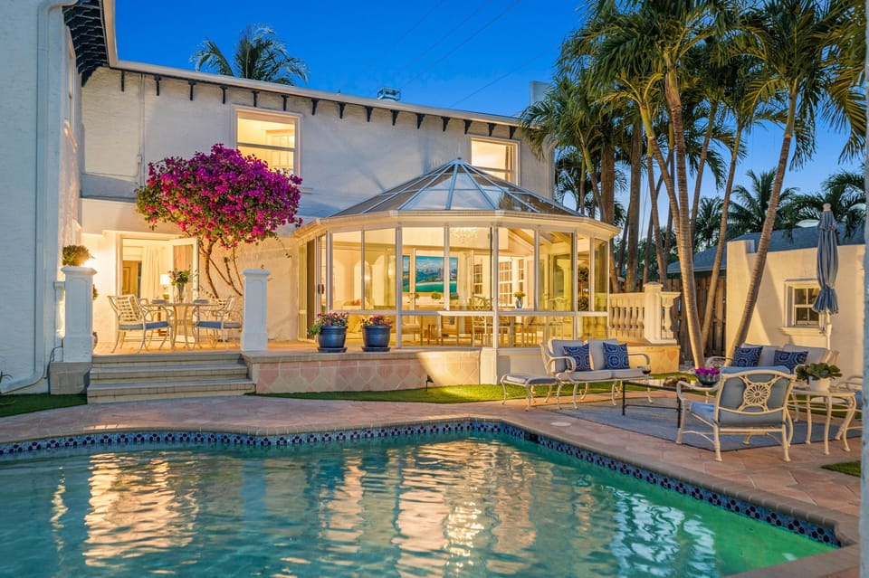 Plenty of seating and lights that light up the backyard so you can enjoy a night swim.