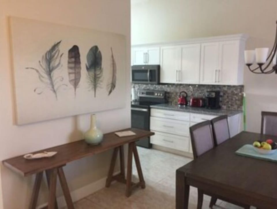 Front hall view , dining room and kitchen view.  