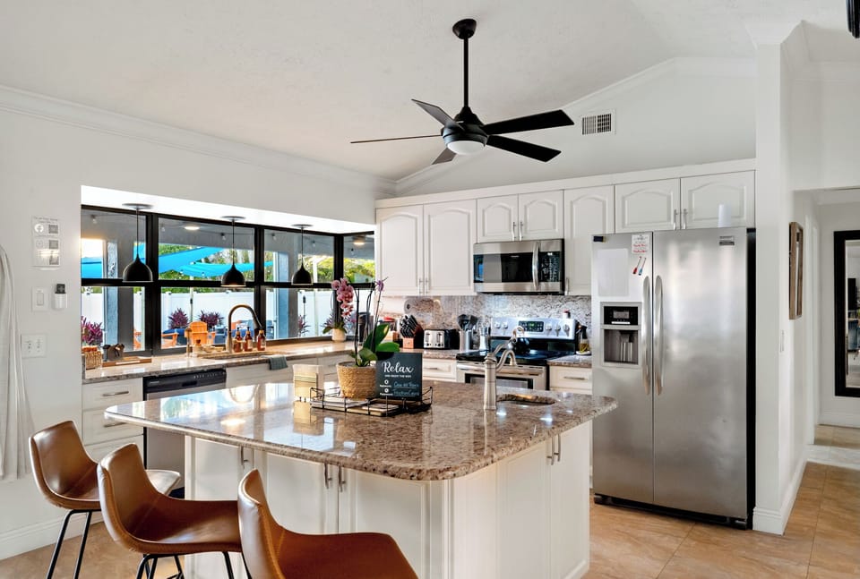 Our fully equipped kitchen is ready for your next meal plus island seating 