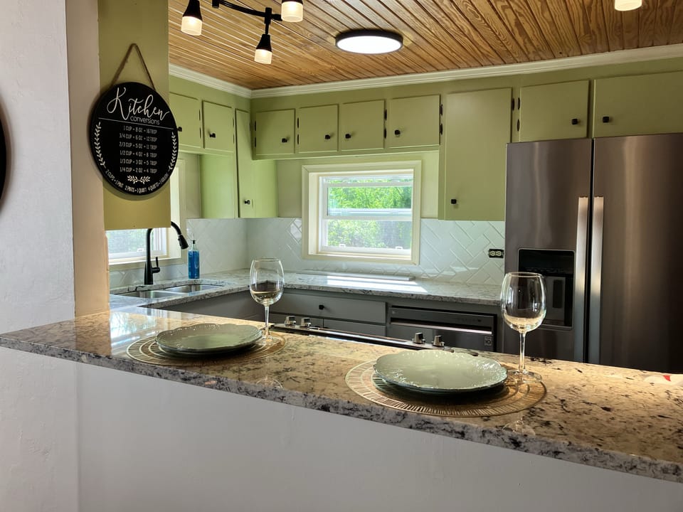 Lots of natural light in this super cute kitchen with new granite countertops.

