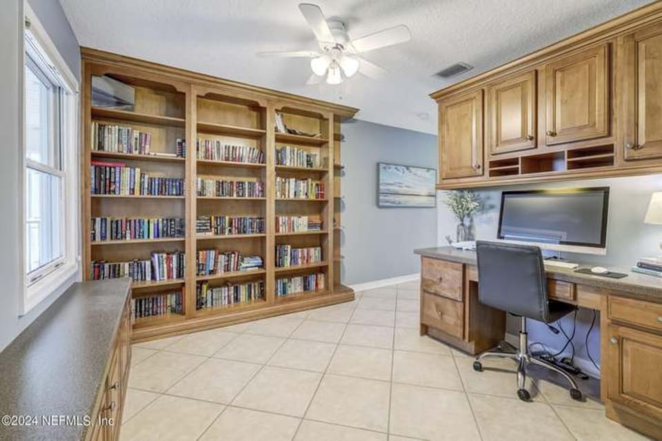 Workspace and library with books on the second floor
