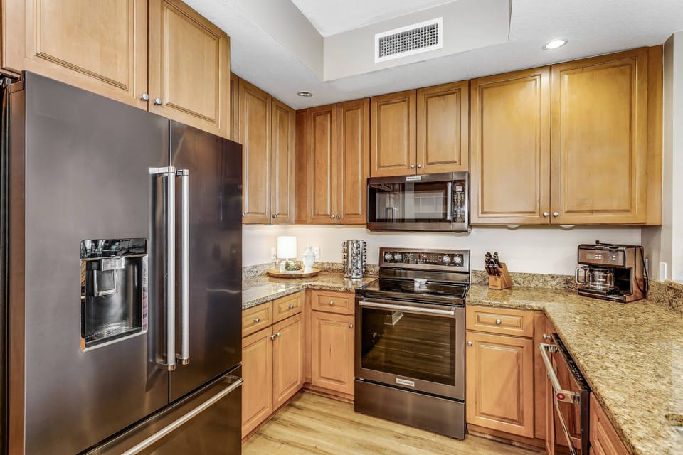 Modern kitchen supplied with what you'll need to cook up family meals