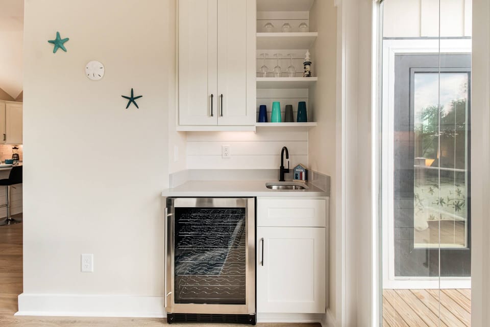 In the Living Area, a Wet Bar with Bar Sink & Beverage Cooler.