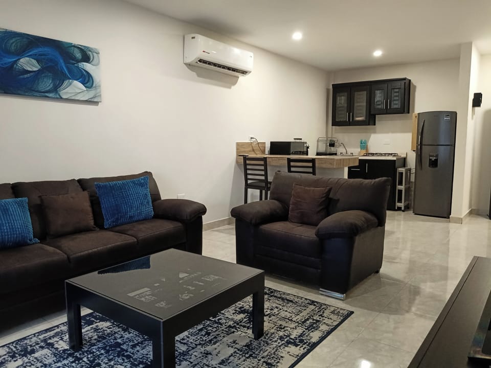 Superior Suite | Living area | 50-inch Smart TV with satellite channels, Netflix, streaming services