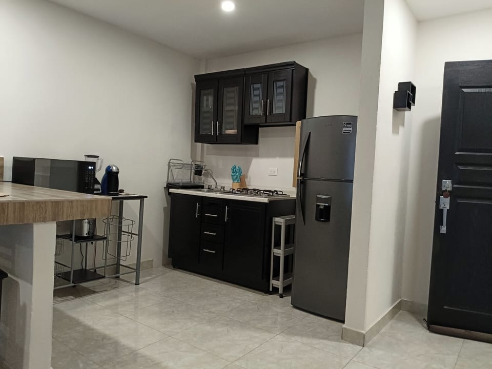 Superior Suite | Private kitchen | Coffee/tea maker, dining tables