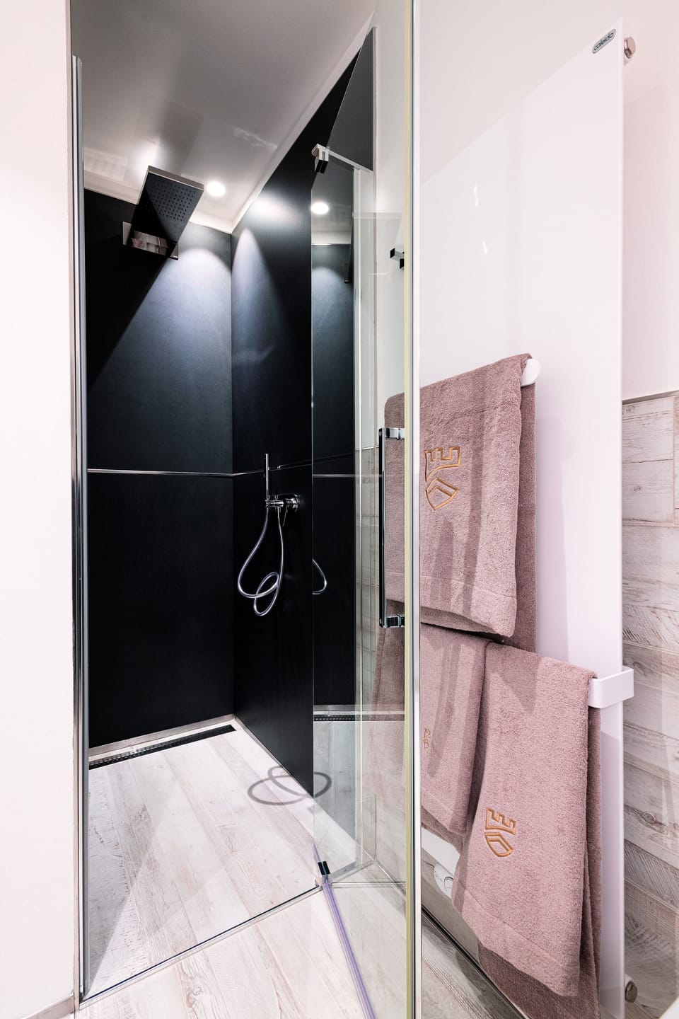 Luxury Condo | Bathroom | Rainfall showerhead, hair dryer, bathrobes, slippers