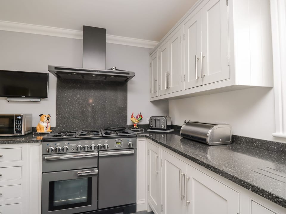 Fridge, electric kettle, toaster, cookware/dishes/utensils