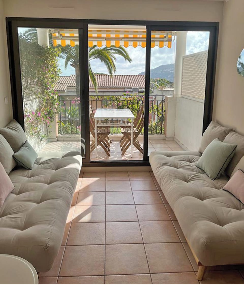 The living room with access to the balcony