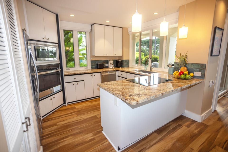 This kitchen, flooded with natural lighting, is meant for a culinary maestro.